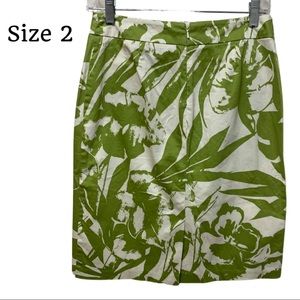 Size 2 Skirt with 2 small front Pockets Zips in back Kick pleat in back